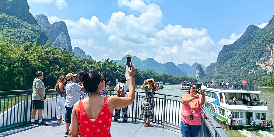 Guests Taking Pictures on Li River Cruise Ship