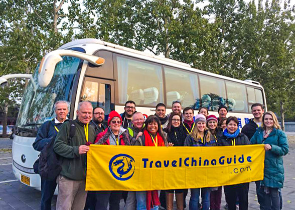 Our customers standing in front of the tour bus